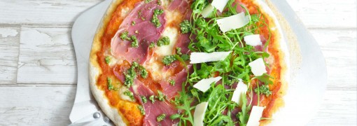 Pizza with parma, pesto and rocket