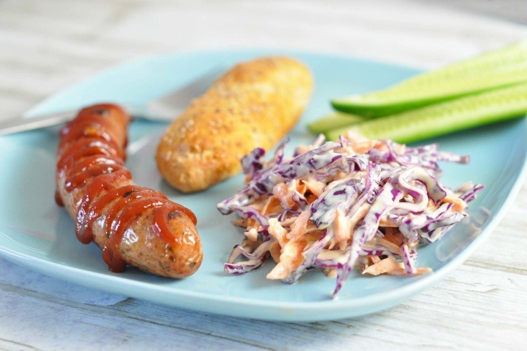 Grill sausages with purple pointed cabbage and carrot slaw