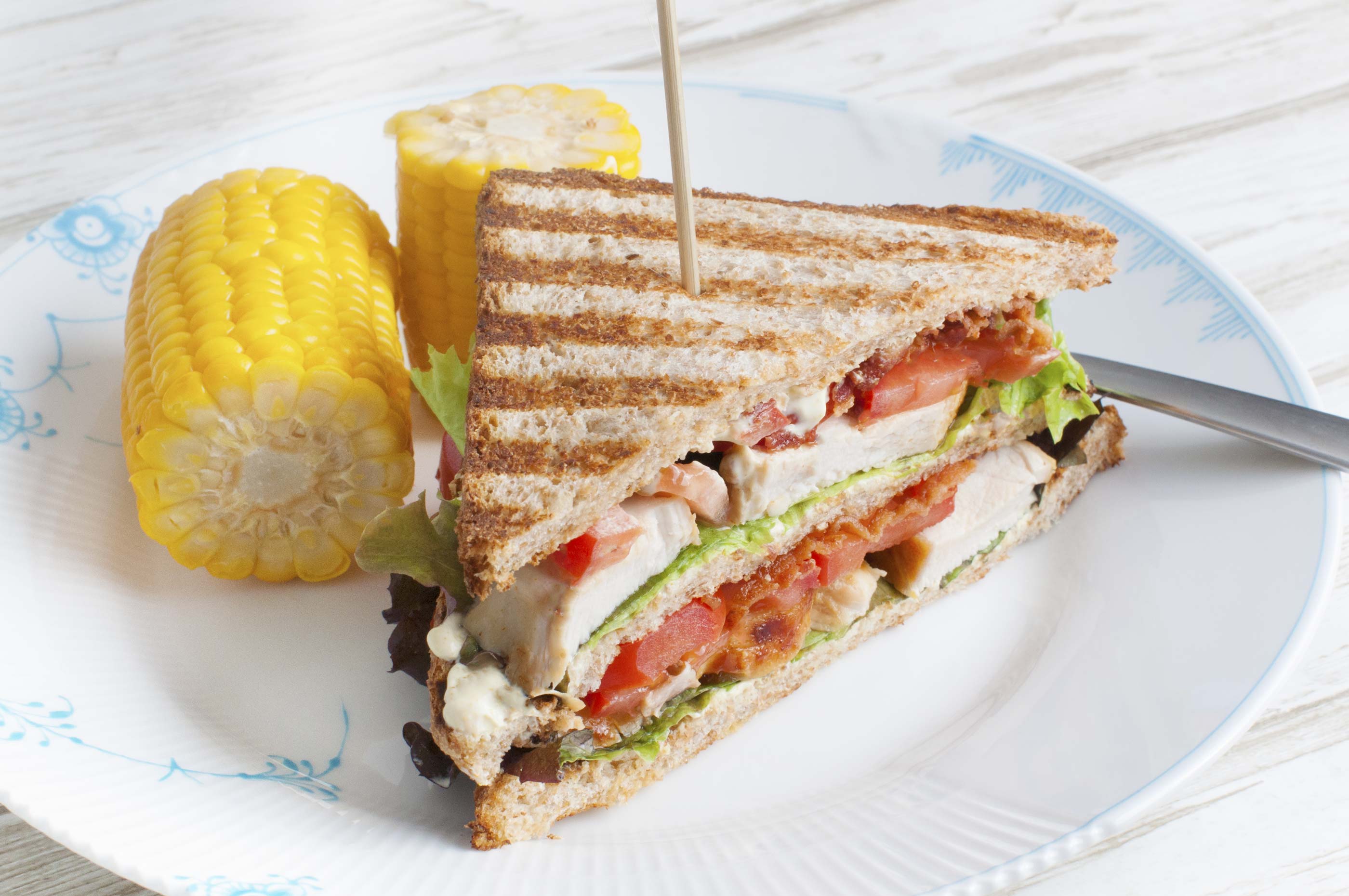 Club sandwich with chicken, bacon, lettuce and curry mayo