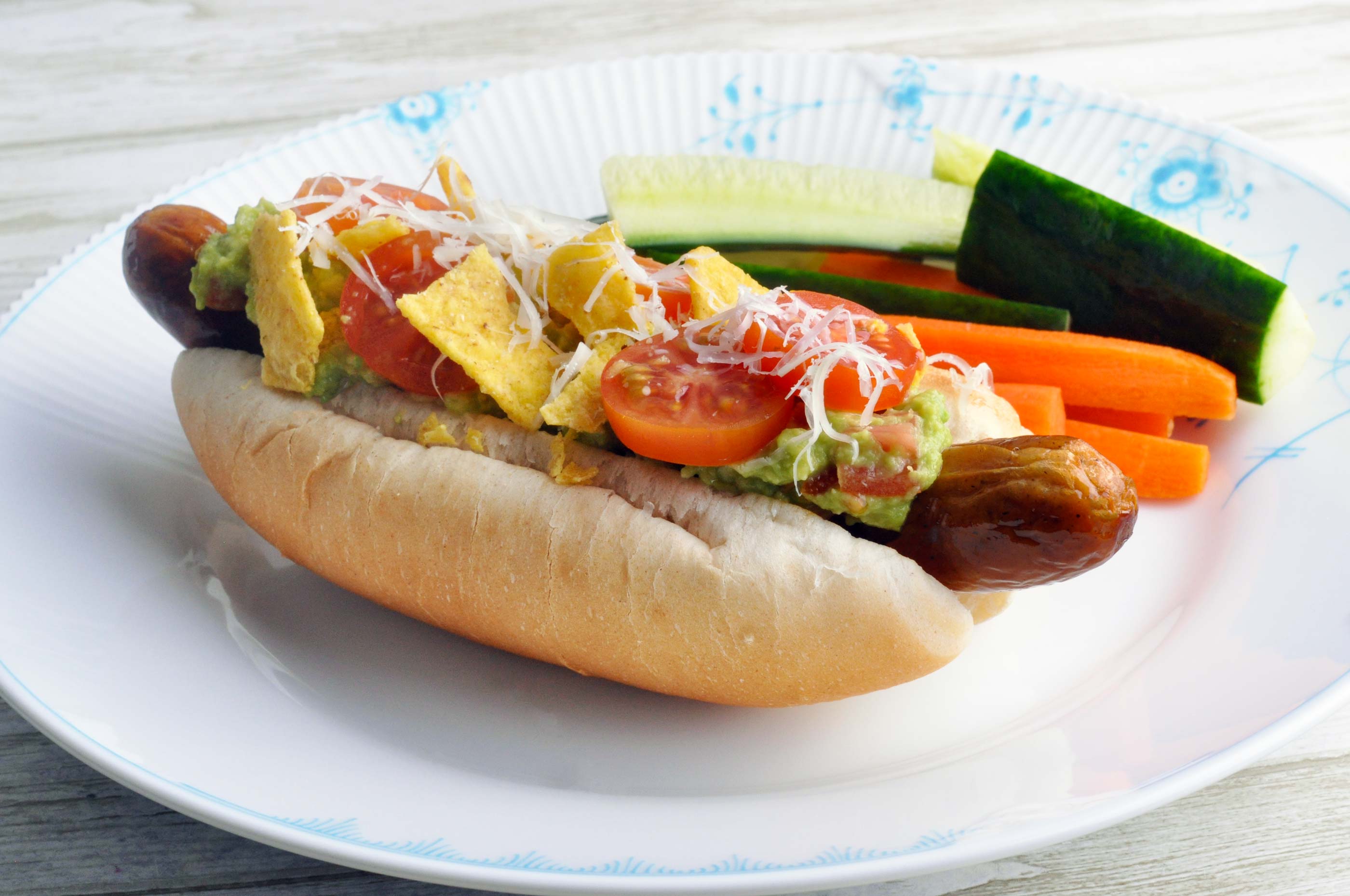 Mexican hot dogs with guacamole and tortilla chips