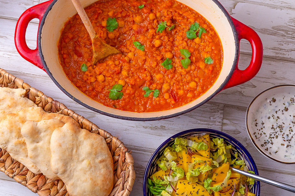 Indian daal with chick peas, raita, naan bread and mango salad