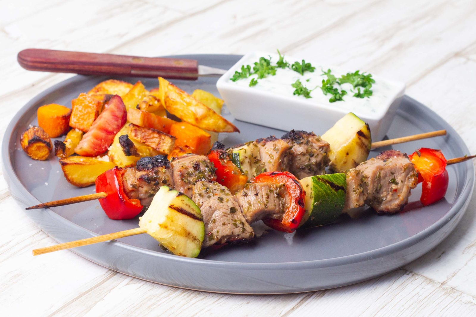 Grill skewers with pork tenderloin, root veg and chive dip
