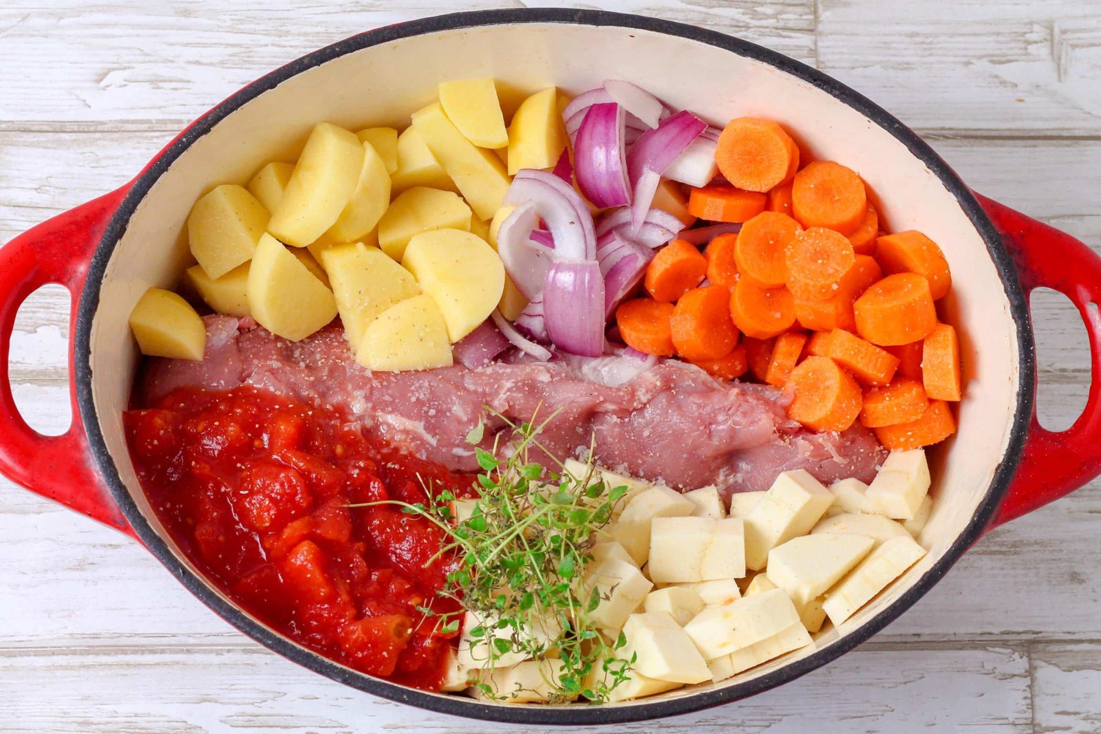 One pot with pork tenderloin, chopped tomatoes and plenty of veggies