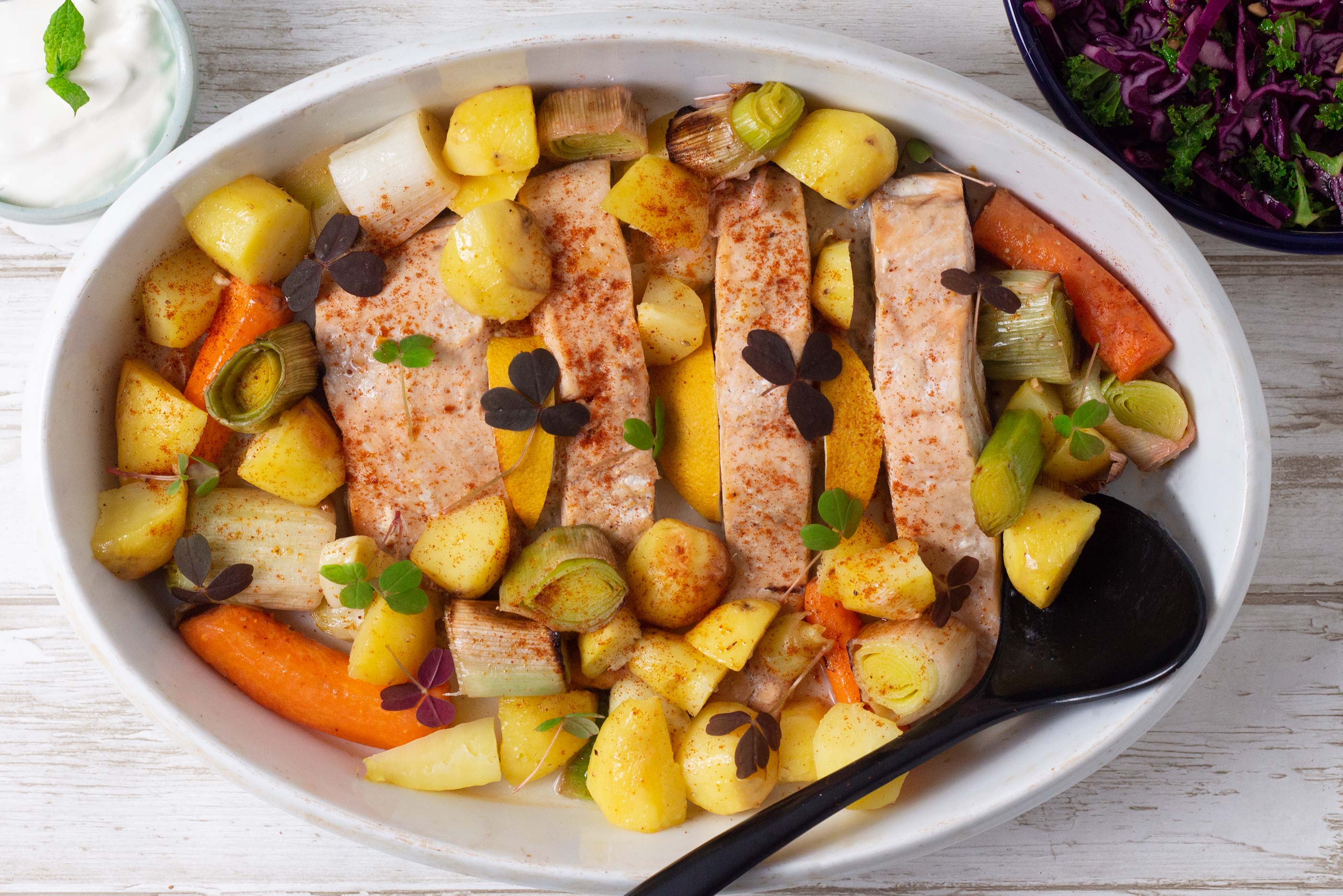 Baked Salmon On A Bed Of Potatoes Leek And Carrots