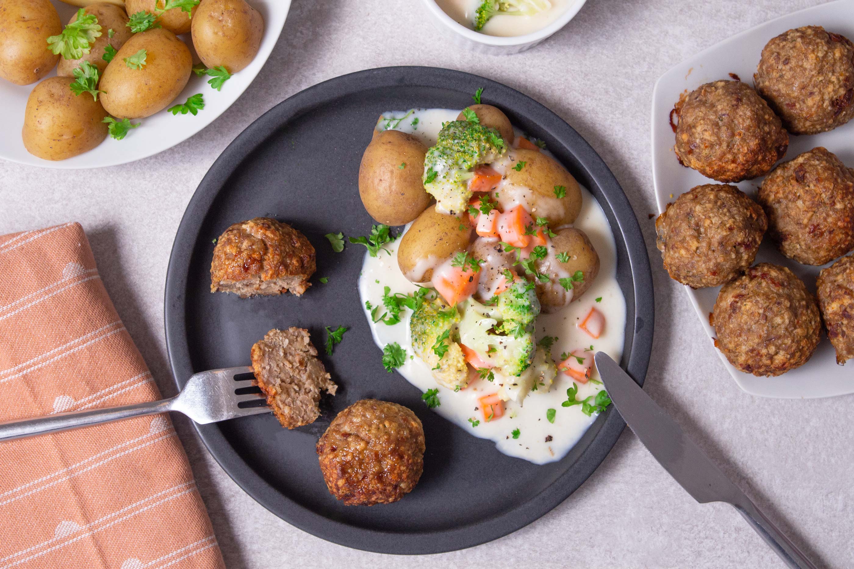 Ovenbaked meatballs with creamed veggies and potatoes