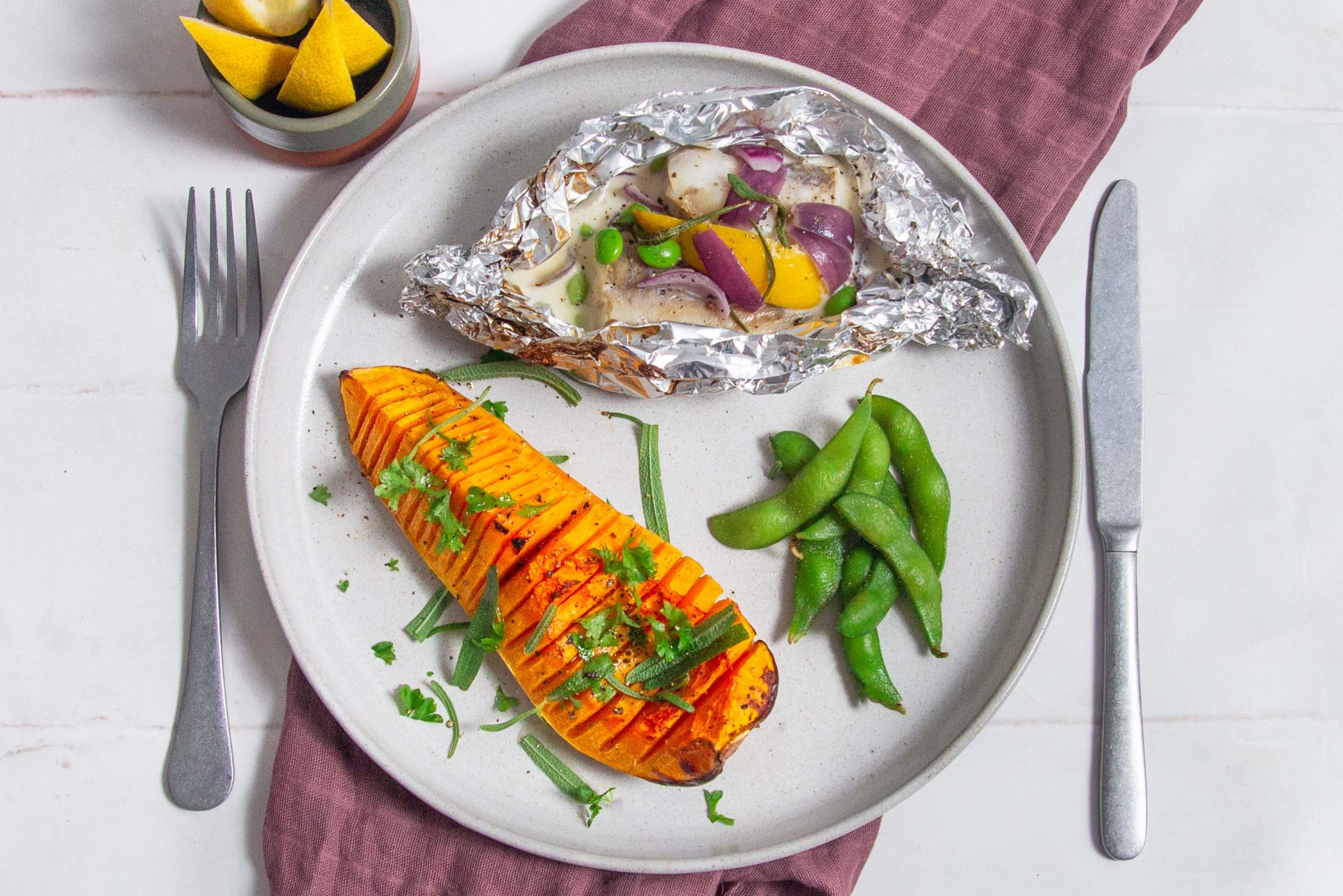 Fish parcels with cream sauce and hasselback butternut squash