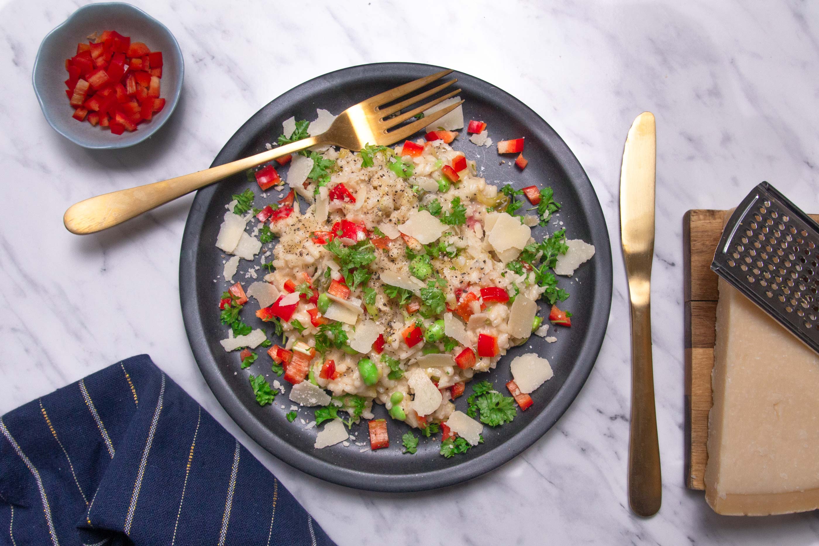 Vegetarian risotto with leek, bell pepper and edamame