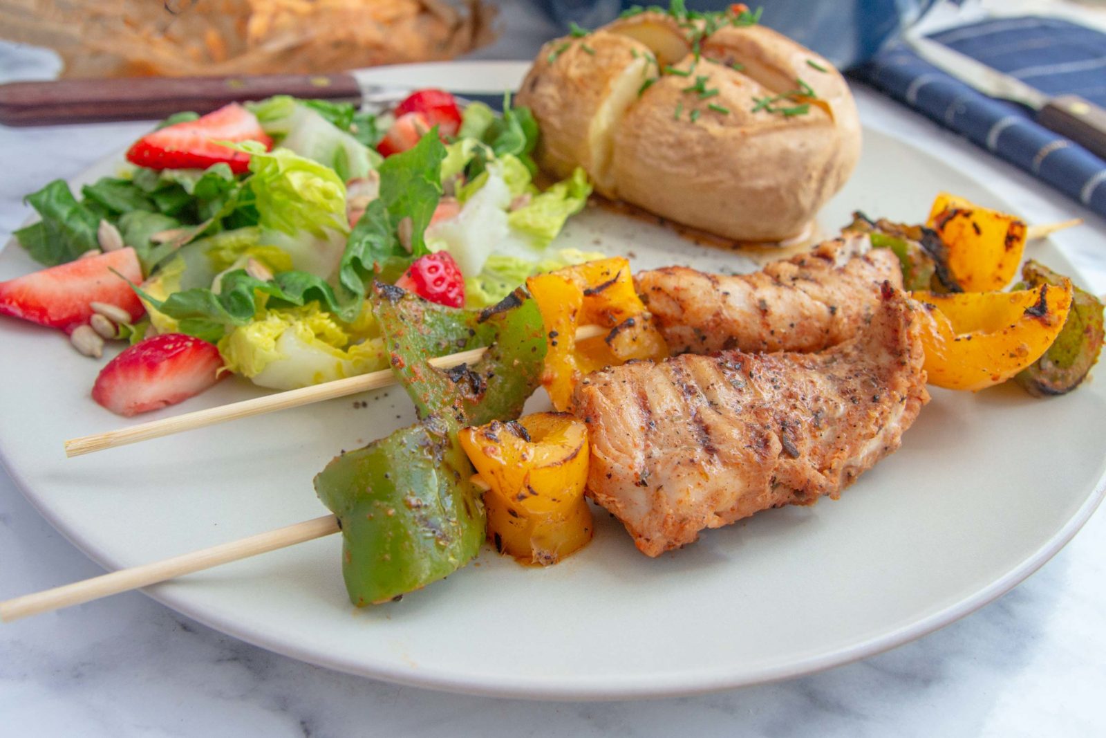 Chicken skewers with baked potatoes and bearnaise butter