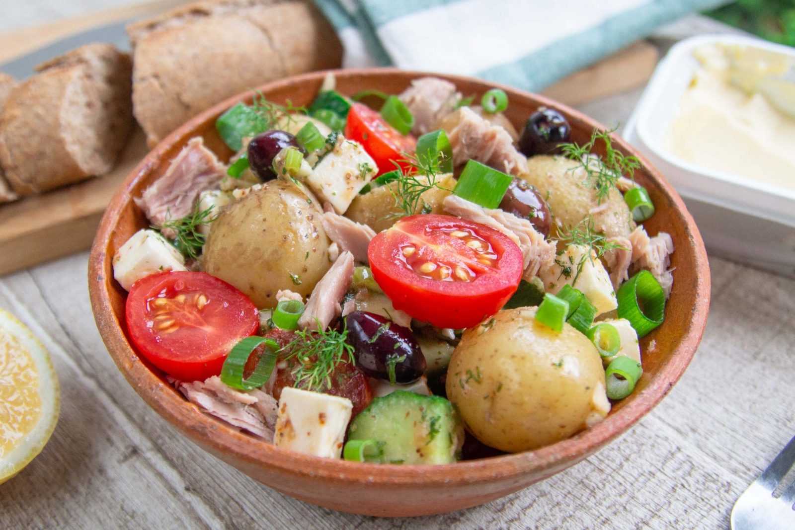 Greek salad with tuna, potatoes, olives and feta