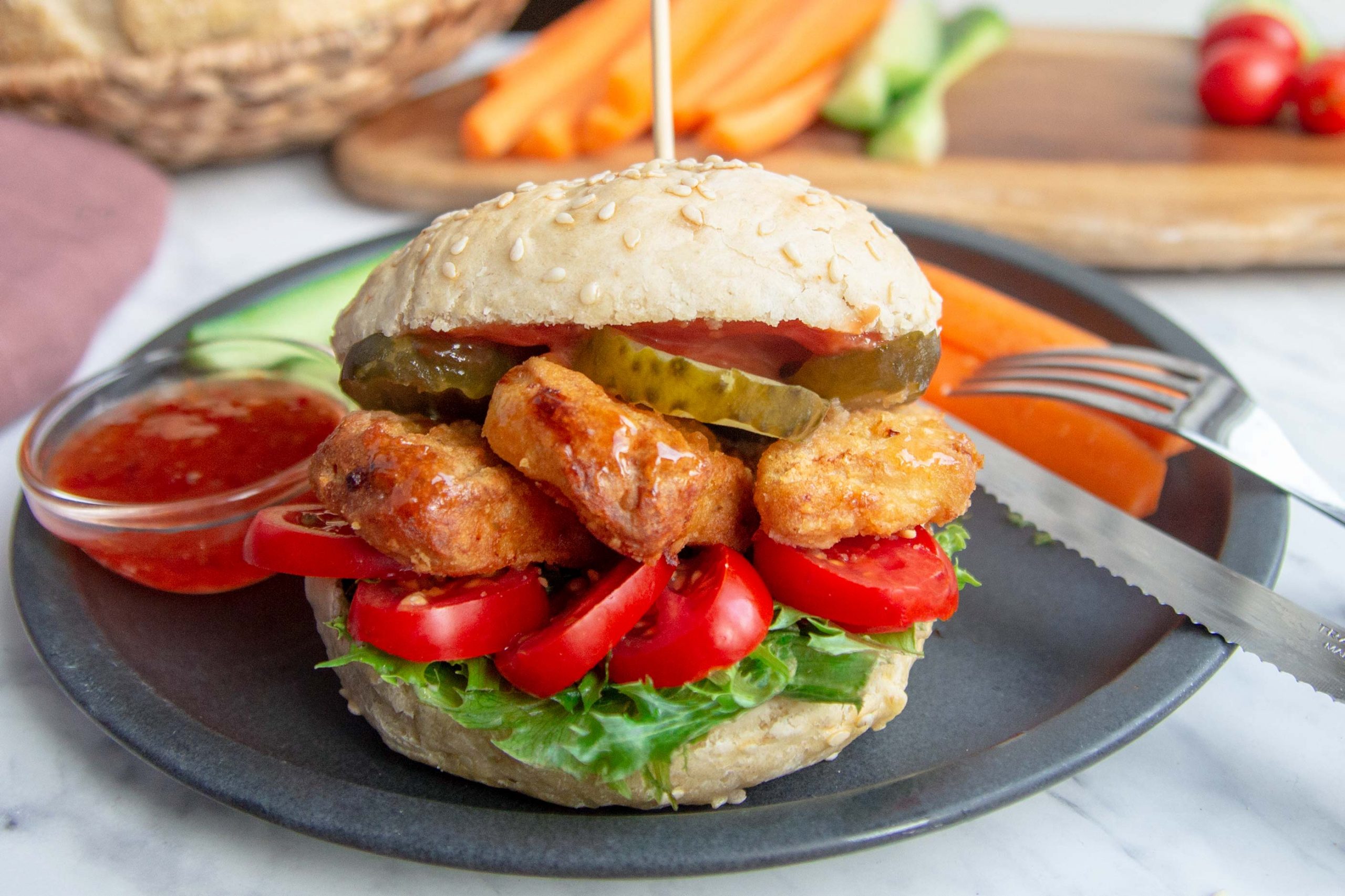 Easy chicken nugget burgers with snack veggies on the side