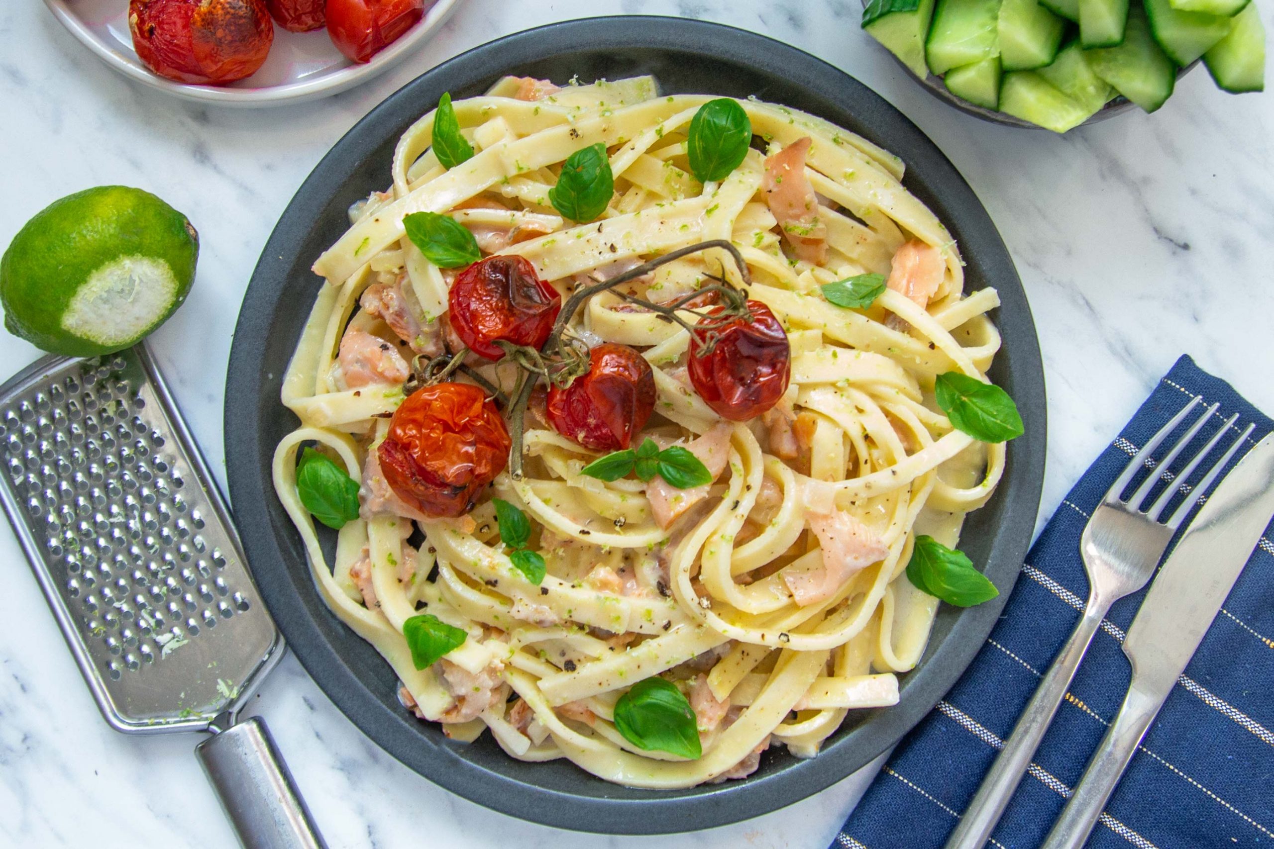 Fresh pasta with salmon, mornay sauce and baked tomatoes